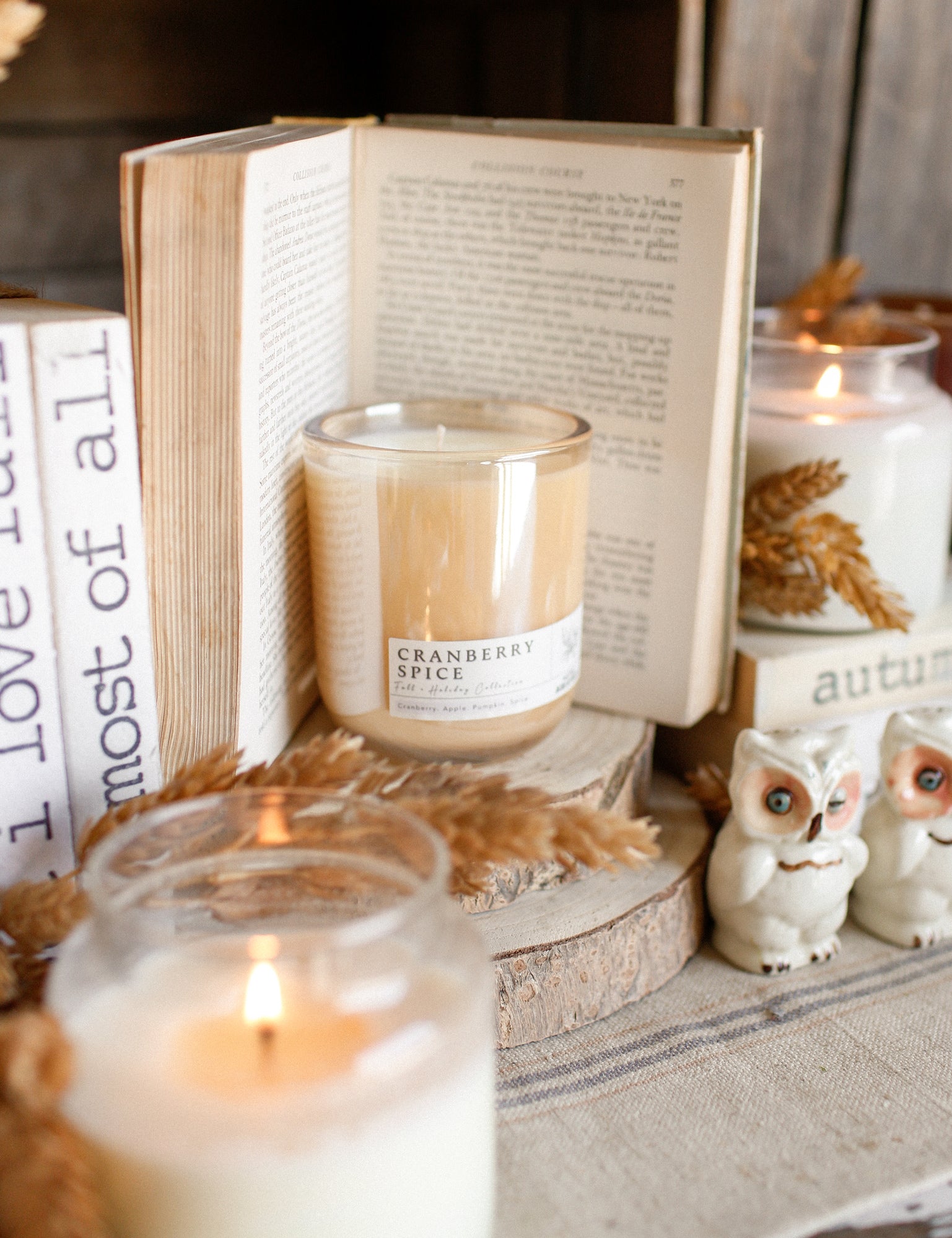 Premium handmade soy candle with warm cranberry and pumpkin spice fragrance