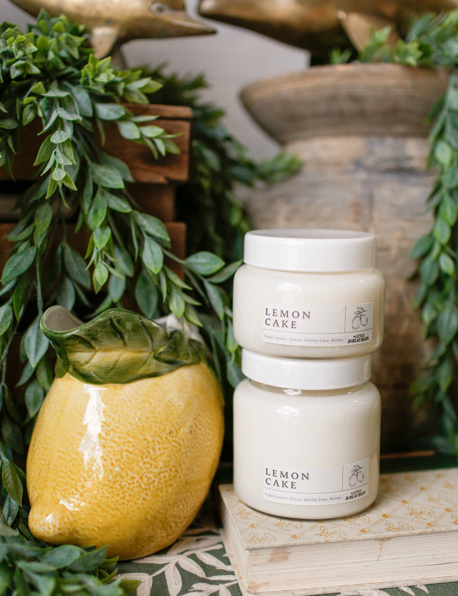 Lemon Cake soy candle in clear glass jar with fresh lemon, vanilla, and bakery scent