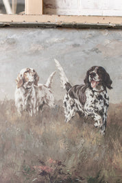 Vintage artwork of two dogs in a field framed in a rustic gray salvaged window frame